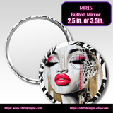 Button mirror with artistic design of a face on a gray background