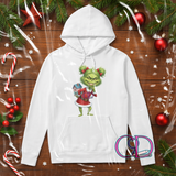 White hoodie with a Green X Mas girl design on a wooden background with Christmas decorations