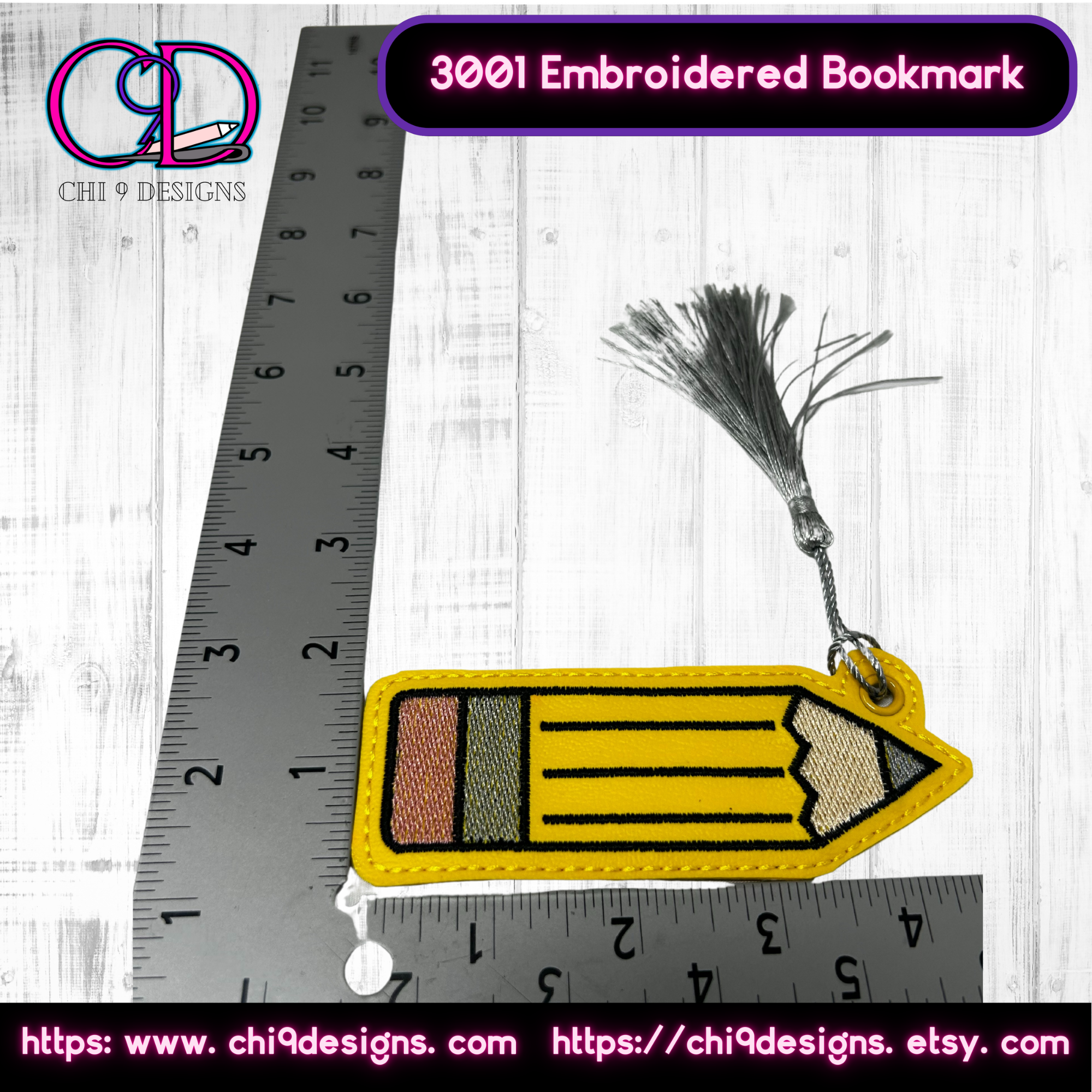 Close-up of an embroidered pencil bookmark with a silver tassel, shown next to a ruler for size reference, highlighting the intricate stitching and vibrant colors