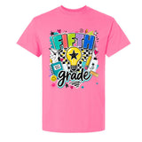 A bright pink short-sleeve t-shirt with a colorful 'FIFTH grade' graphic on the chest, featuring a lightbulb, pencil, notebook, and stars on a white background.