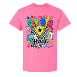 A bright pink short-sleeve t-shirt with a colorful 'SEVENTH grade' graphic on the front, featuring a lightbulb, stars, hearts, and school supplies, shown against a plain white background.