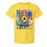 A bright yellow short-sleeve t-shirt with a colorful 'Third Grade' graphic on the front, featuring school-themed doodles and text, shown against a plain white background.