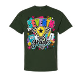 A dark forest green short-sleeve t-shirt with a colorful graphic on the chest that reads 'SEVENTH grade' in playful multicolored lettering, surrounded by school-themed doodles like a lightbulb, pencil, notebook, and stars.