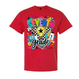 A red short-sleeve crewneck t-shirt featuring a colorful graphic on the front that reads 'SEVENTH grade' with doodle-style illustrations including a lightbulb, pencil, notebook, and stars.