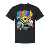 A black short-sleeve crewneck t-shirt featuring a colorful graphic print on the front that reads 'SECOND grade' with school-themed doodles including a lightbulb, notebook, pencil, and hearts.