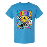 A bright blue heather short-sleeve t-shirt with a colorful 'SECOND grade' graphic on the front, featuring school-themed doodles like a lightbulb, notebook, and pencil, displayed on a solid white background.