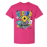 A bright pink short-sleeve crewneck t-shirt featuring a colorful 'Second Grade' graphic on the front, complete with a lightbulb, stars, hearts, and school supplies.