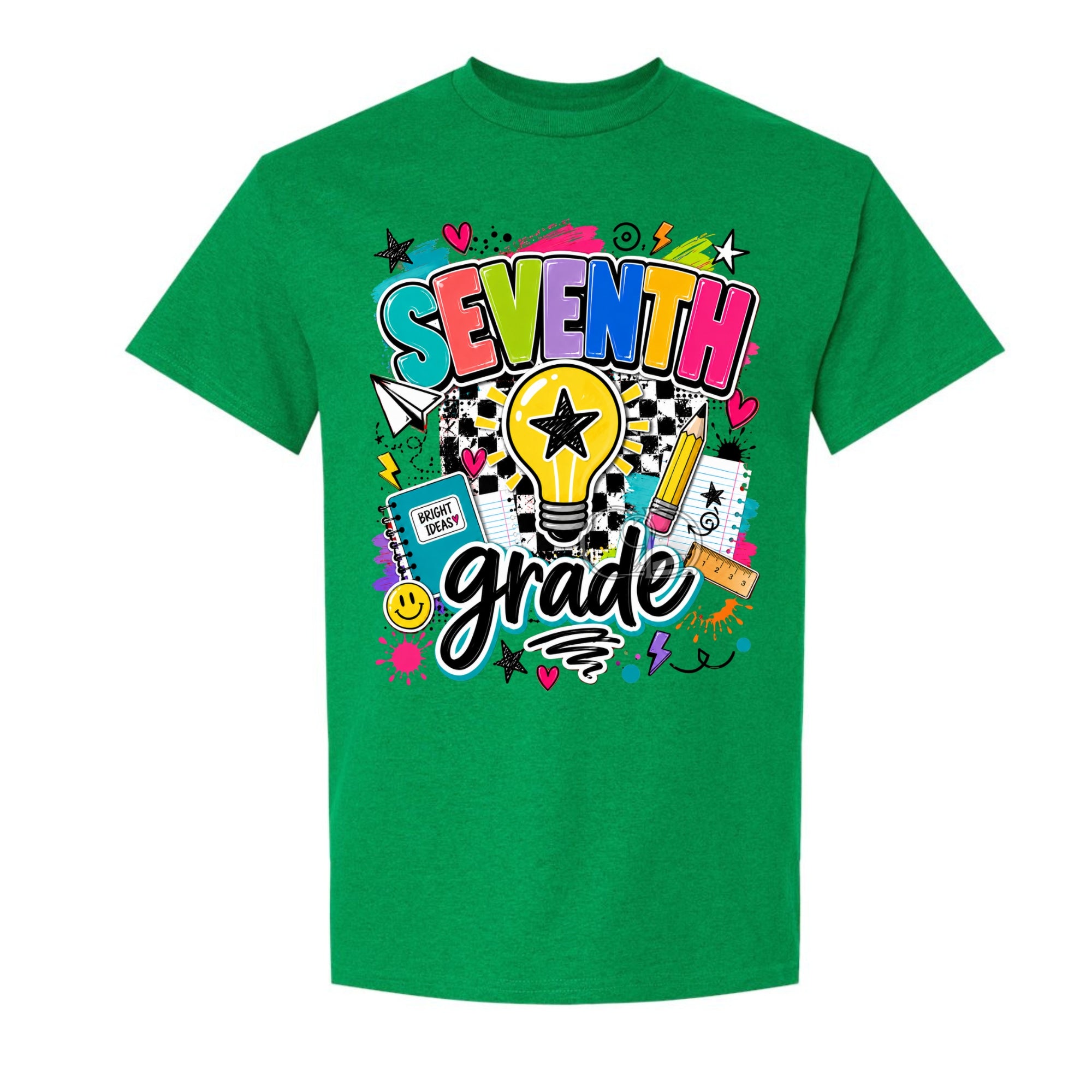 A green short-sleeve crewneck t-shirt featuring a colorful 'SEVENTH grade' graphic on the front, complete with a lightbulb, stars, hearts, and school-themed doodles, shown against a plain white background.