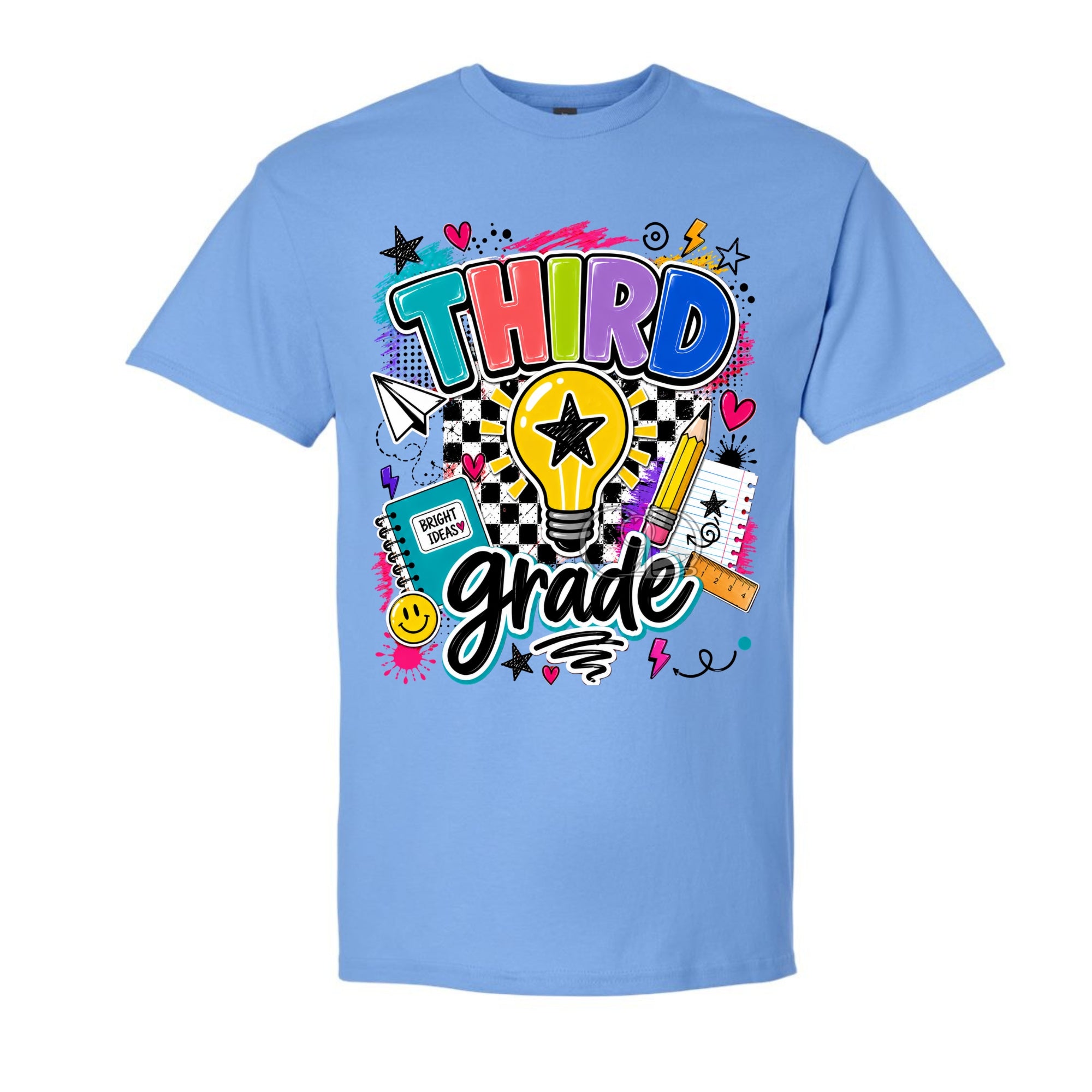 A light blue short-sleeve crewneck t-shirt featuring a colorful graphic design on the front with the words 'THIRD grade' in stylized lettering, surrounded by school-themed doodles like a lightbulb, pencil, notebook, and stars.