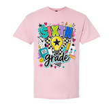 A light pink short-sleeve crewneck t-shirt featuring a colorful 'SIXTH grade' graphic on the front, complete with a lightbulb, stars, hearts, and school-themed doodles, shown against a plain white background.