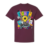 A maroon short-sleeve crewneck t-shirt featuring a colorful 'EIGHTH Grade' graphic on the front, complete with a lightbulb, pencil, notebook, and stars, shown against a plain white background.