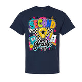 A navy blue short-sleeve t-shirt with a colorful graphic on the front that reads 'SECOND grade' in playful multicolor lettering, surrounded by school-themed doodles like a lightbulb, notebook, pencil, and stars.
