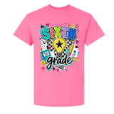 A bright pink short-sleeve crewneck t-shirt featuring a colorful 'SIXTH grade' graphic on the front, complete with a lightbulb, stars, hearts, and school supplies, shown against a plain white background.