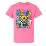 A bright pink short-sleeve crewneck t-shirt featuring a colorful 'Second Grade' graphic on the front, complete with school supplies, a lightbulb, and stars.