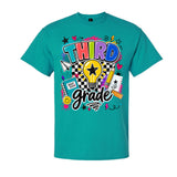 A teal short-sleeve crewneck t-shirt featuring a colorful graphic on the front that reads 'THIRD grade' with school-themed doodles including a lightbulb, pencil, notebook, and stars.