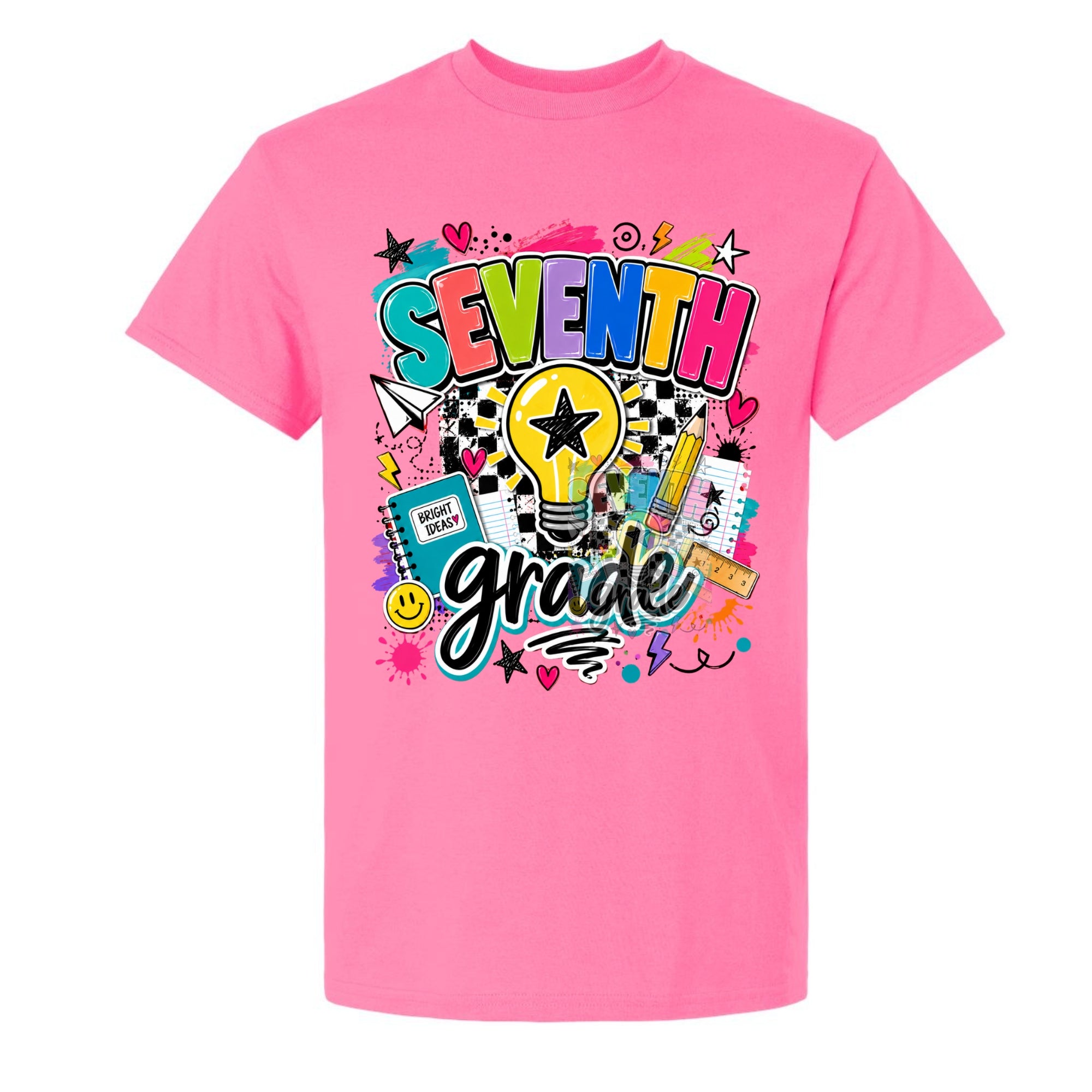 A bright pink short-sleeve t-shirt with a colorful 'SEVENTH grade' graphic on the front, featuring a lightbulb, stars, hearts, and school supplies, shown against a plain white background.