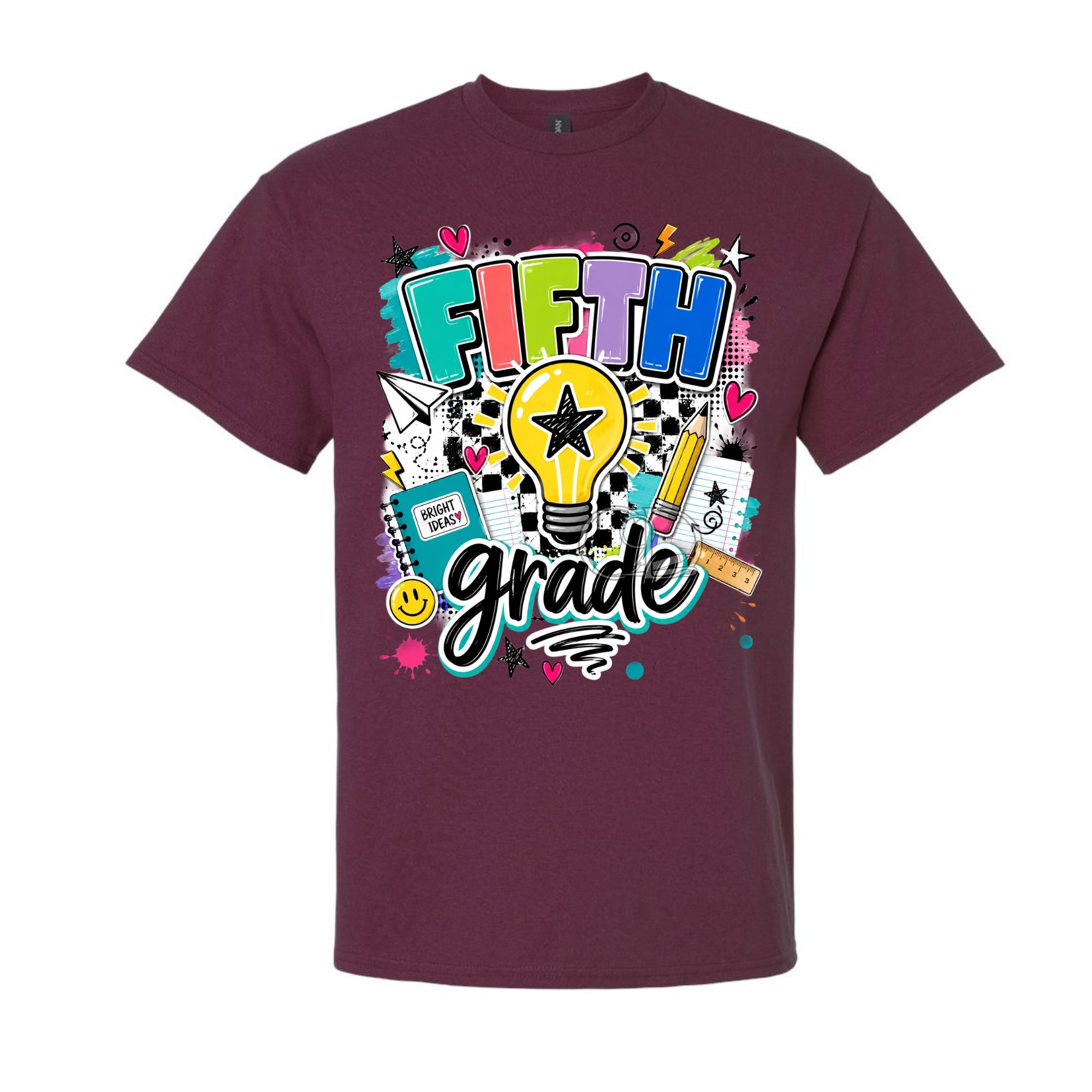 A maroon short-sleeve crewneck t-shirt featuring a colorful 'FIFTH grade' graphic on the front, complete with a lightbulb, pencil, notebook, and stars.