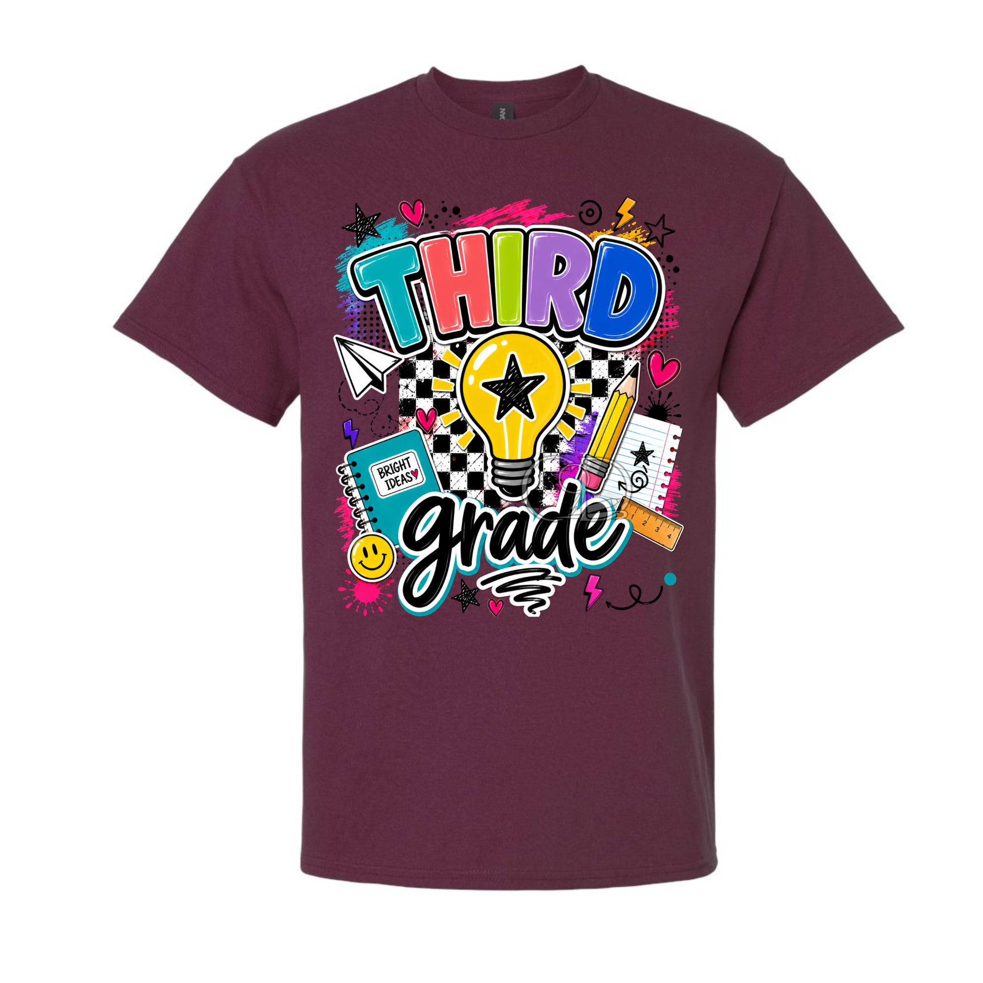 A maroon short-sleeve crewneck t-shirt featuring a colorful 'Third Grade' graphic on the front, complete with a lightbulb, checkered pattern, and school-themed doodles, shown against a plain white background.