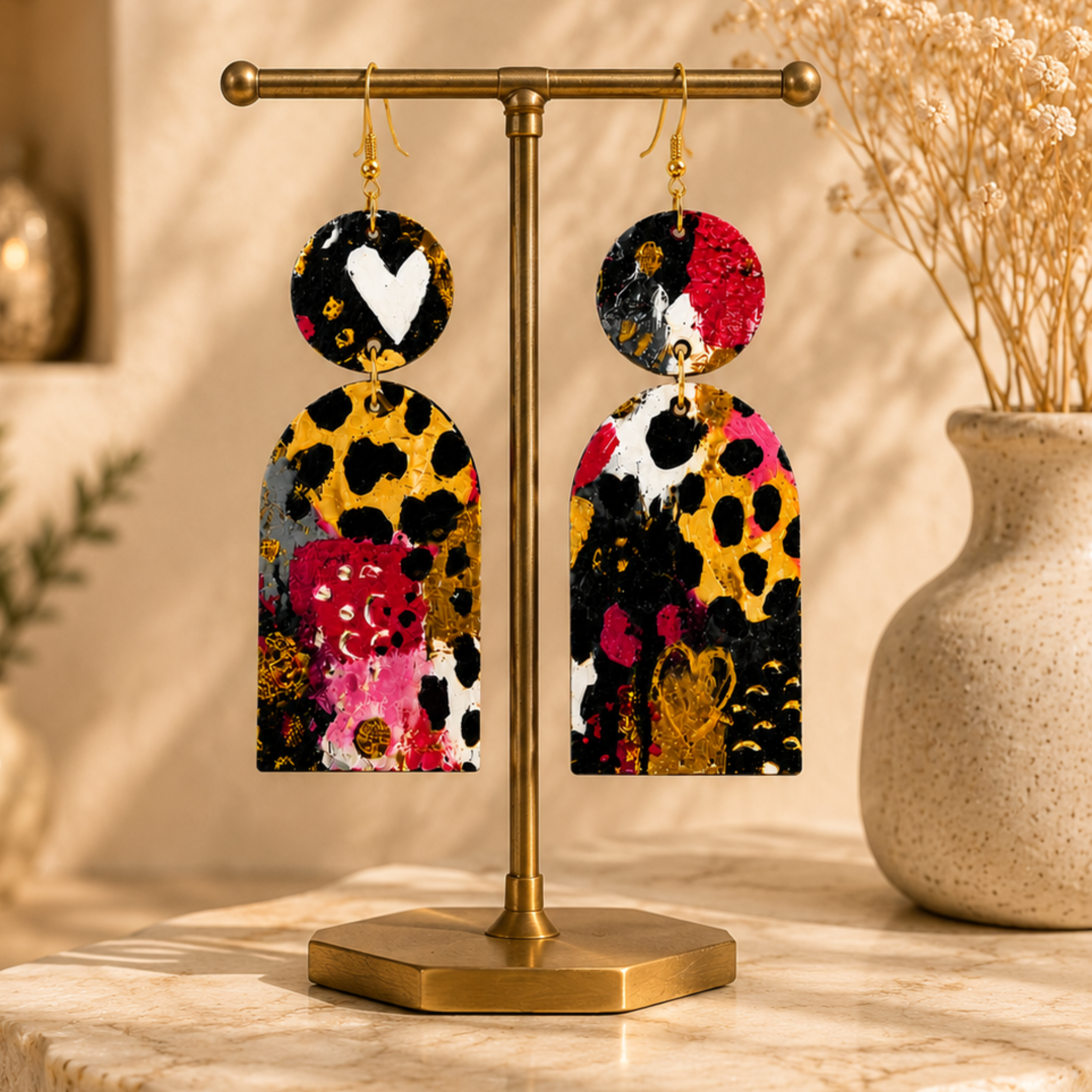 Handmade wood statement earrings displayed on a brass jewelry stand in a luxury boutique setting.
