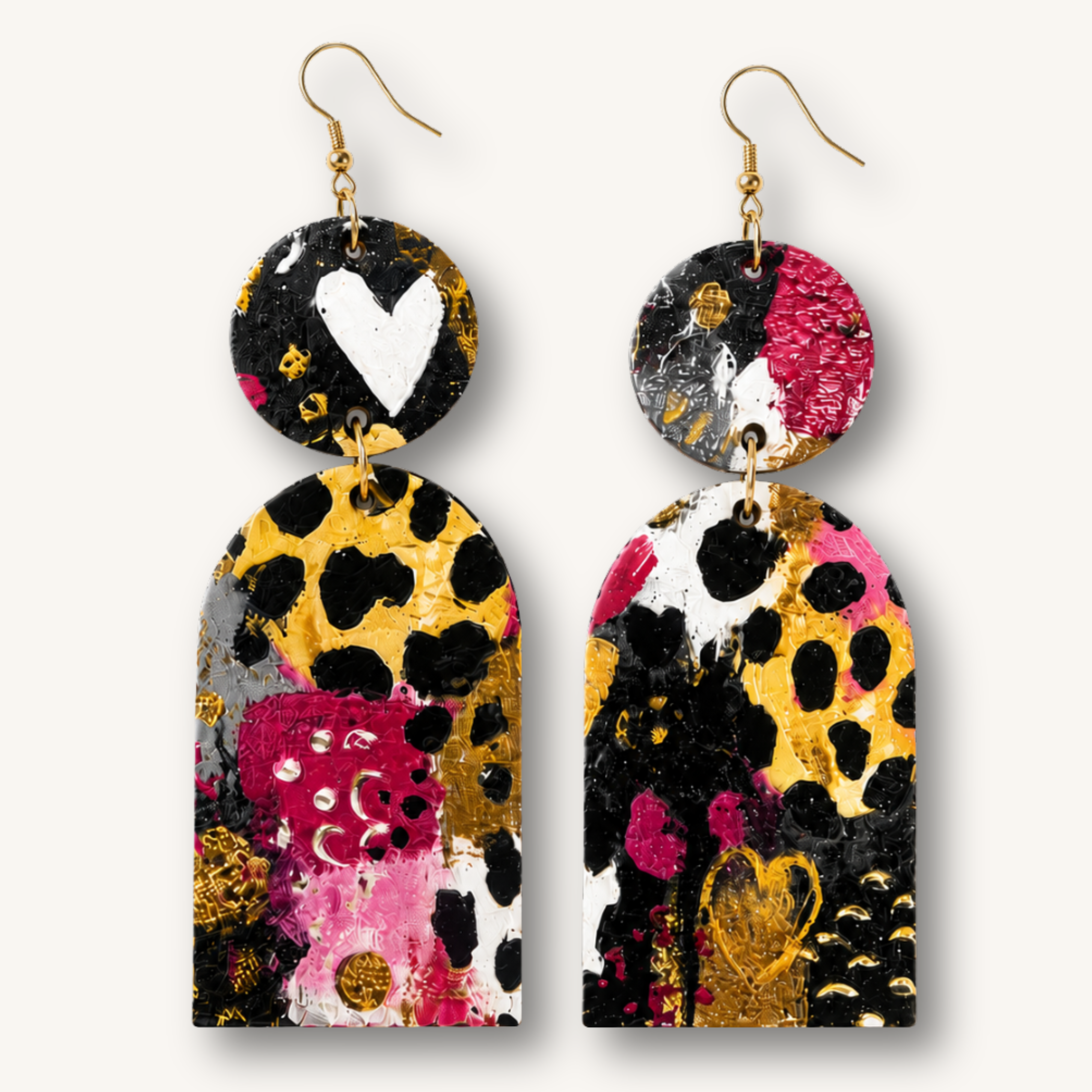 Handmade wood statement earrings featuring colorful abstract artwork with black, gold, pink, and white accents.