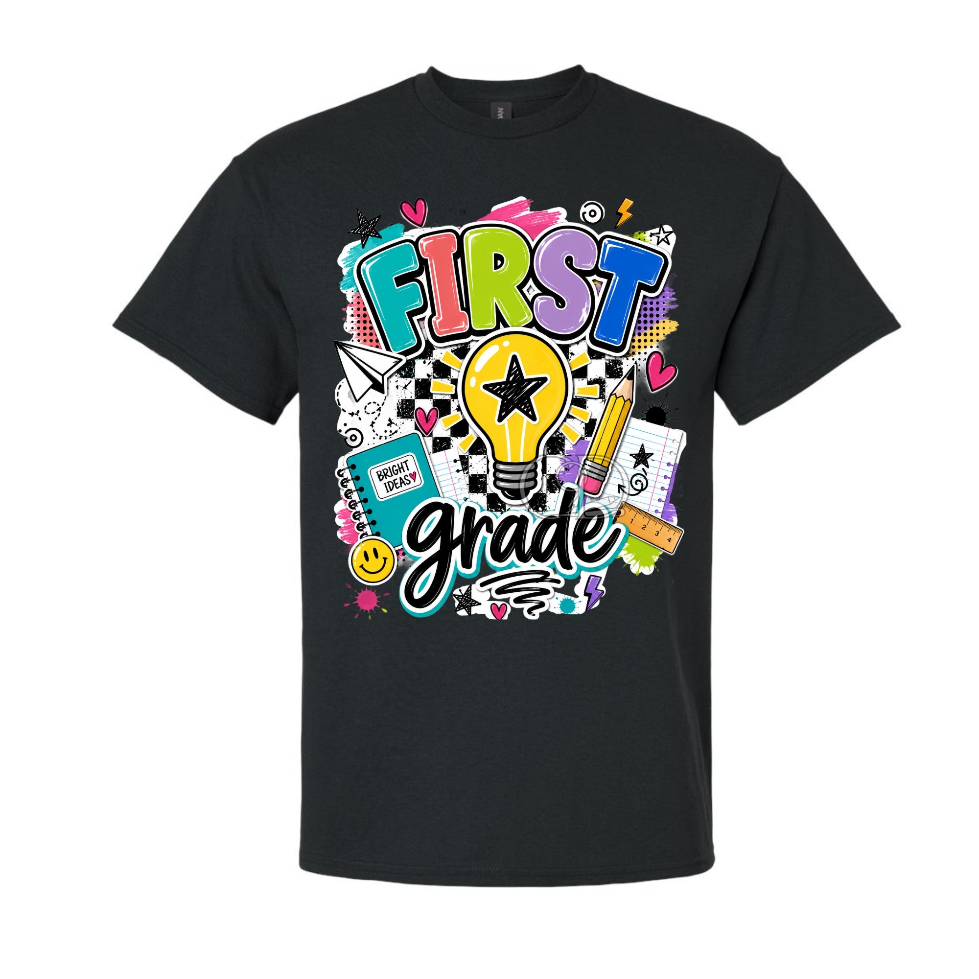 A black short-sleeve crewneck t-shirt featuring a colorful 'First Grade' graphic on the front, complete with a lightbulb, pencil, notebook, and checkered patterns, shown against a plain white background.