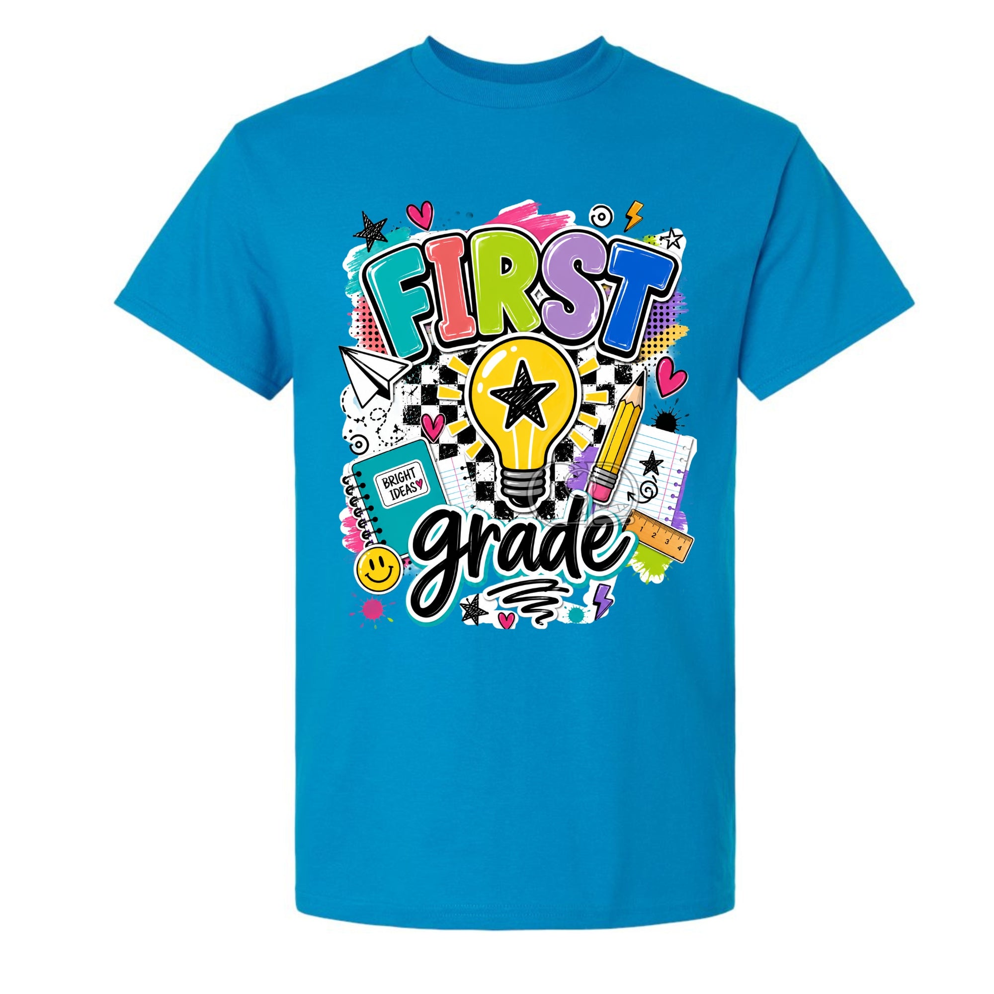 A bright blue short-sleeve crewneck t-shirt featuring a colorful 'FIRST grade' graphic on the front, complete with a lightbulb, stars, hearts, and school-themed doodles.