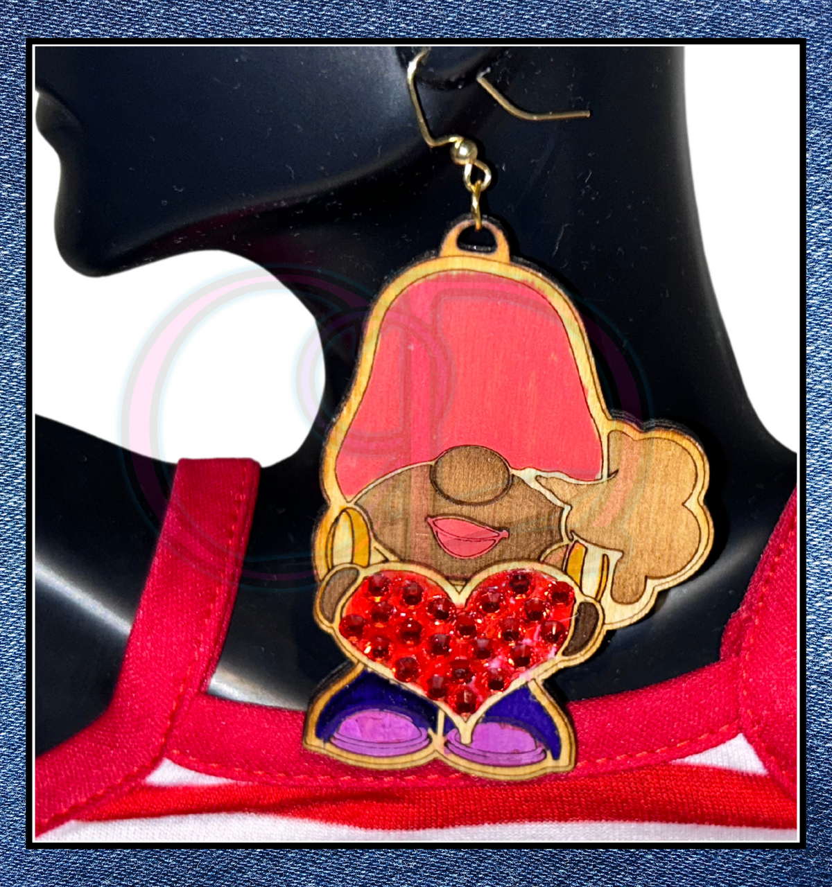 Embrace whimsy with our wooden earrings, showcasing a delightful African American gnome cradling a glinting rhinestone heart. Simple yet enchanting, they're a magical addition to your jewelry collection.