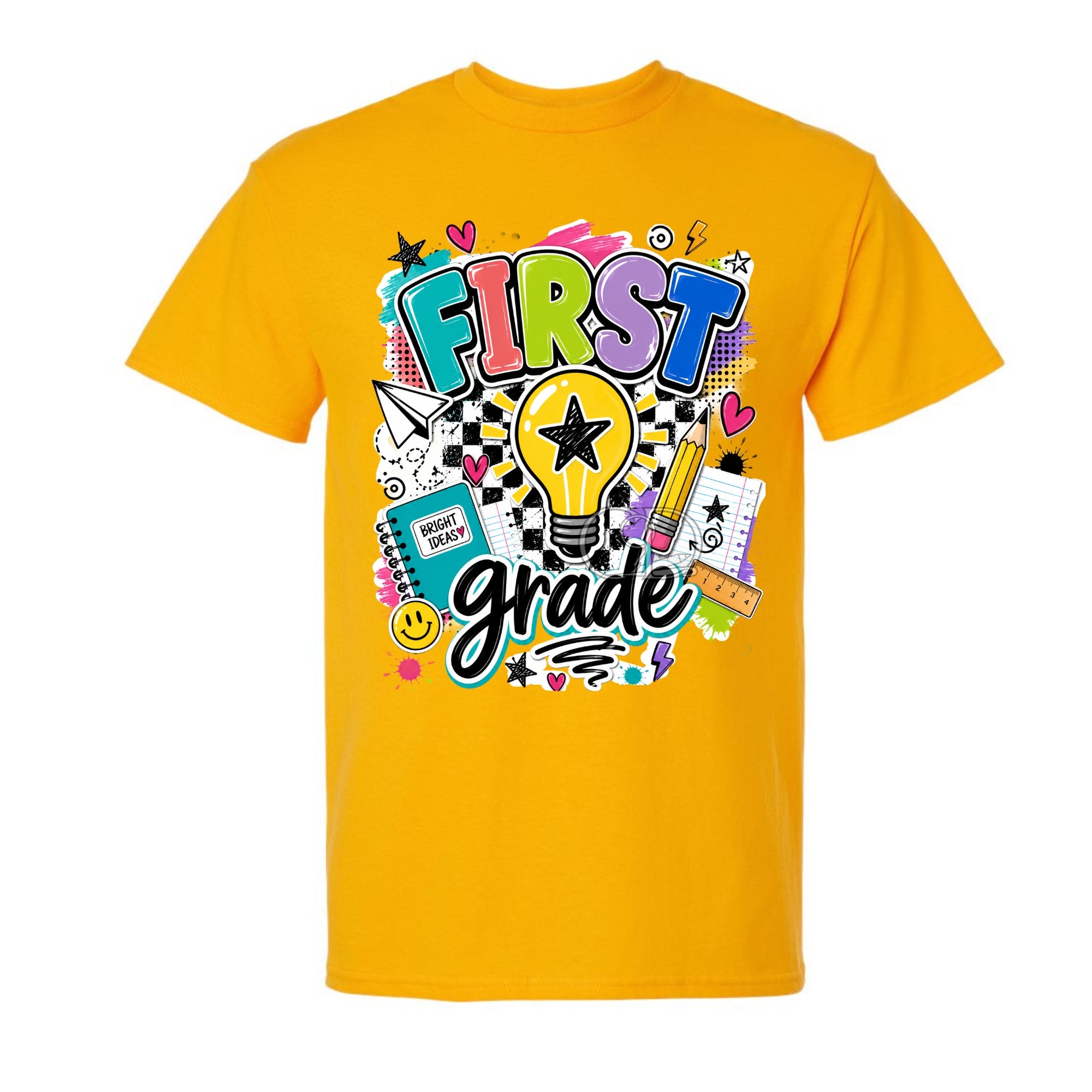 A gold short-sleeve t-shirt with a colorful 'FIRST grade' graphic on the front, featuring school-themed doodles and text, shown against a plain white background.