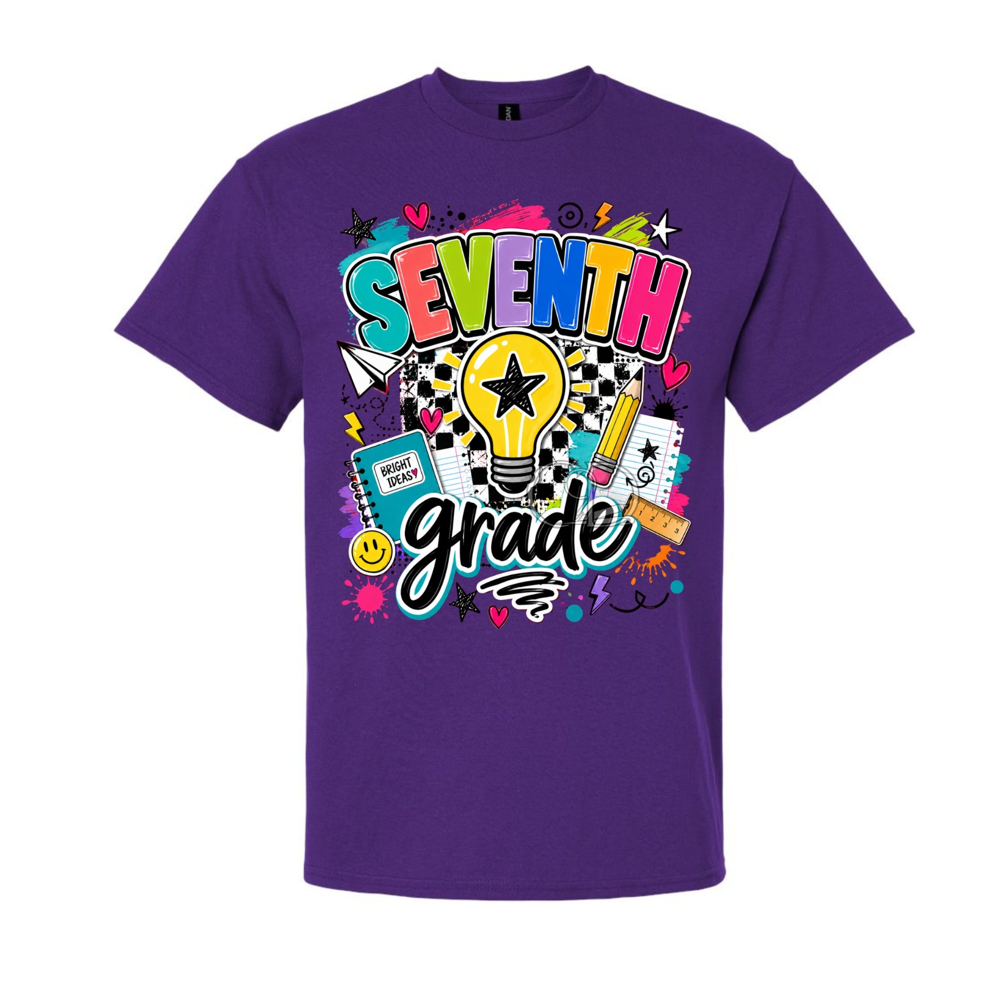 A purple short-sleeve crewneck t-shirt featuring a colorful graphic on the front that reads 'SEVENTH grade' with school-themed doodles like a lightbulb, pencil, notebook, and stars.