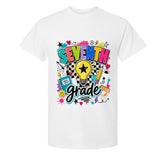 A white short-sleeve crewneck t-shirt featuring a colorful 'SEVENTH grade' graphic on the front, complete with a lightbulb, stars, hearts, and school supplies.